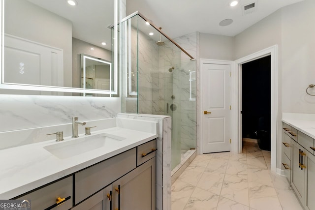 full bath with visible vents, recessed lighting, vanity, a marble finish shower, and marble finish floor