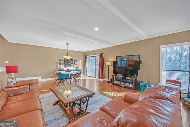 living room featuring beamed ceiling, recessed lighting, wood finished floors, and baseboards