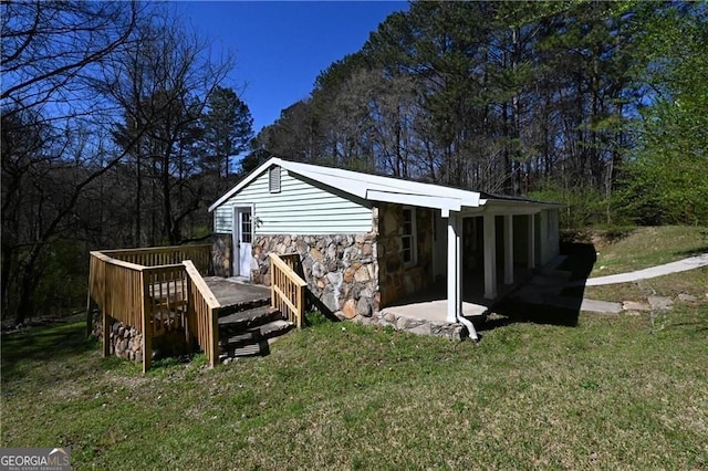 6886 Upshaw Mill Rd, Douglasville, GA 30134 - back of property with stone siding, a yard, and a deck