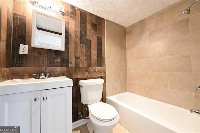 6886 Upshaw Mill Rd, Douglasville, GA 30134 - full bathroom featuring toilet, a textured ceiling, vanity, shower / tub combination, and wooden walls