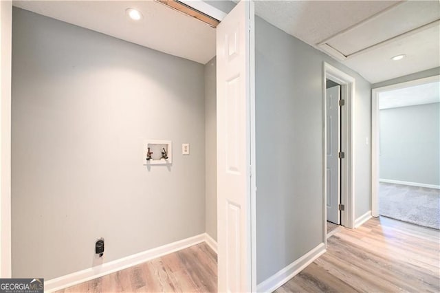 6886 Upshaw Mill Rd, Douglasville, GA 30134 - washroom featuring hookup for a washing machine, baseboards, light wood-style flooring, and recessed lighting