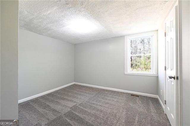 6886 Upshaw Mill Rd, Douglasville, GA 30134 - carpeted spare room with a textured ceiling and baseboards