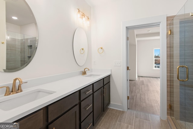 2219 Nena Way Unit 22, Tucker, GA 30084 - bathroom with double vanity, baseboards, a stall shower, and a sink