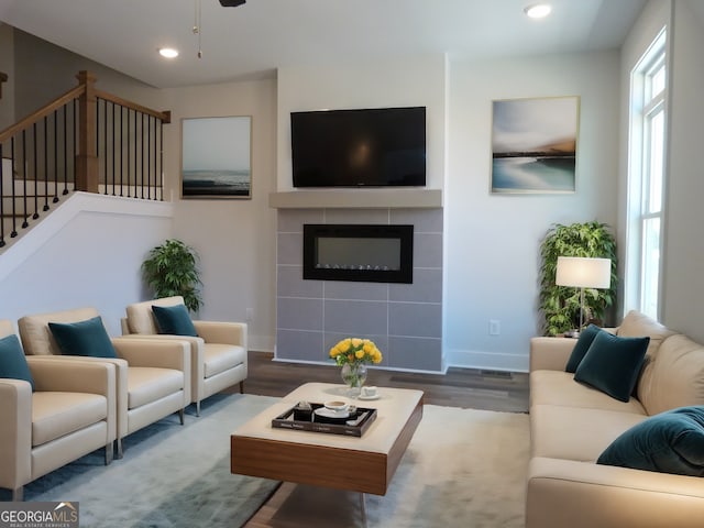 2219 Nena Way Unit 22, Tucker, GA 30084 - living room featuring stairway, wood finished floors, baseboards, recessed lighting, and a tiled fireplace