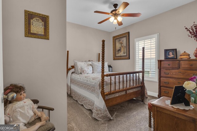 bedroom with carpet, baseboards, and a ceiling fan