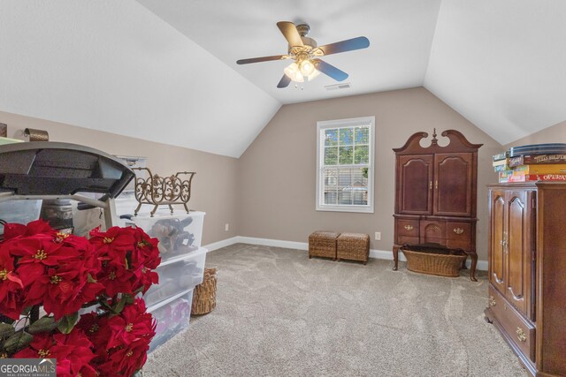 bonus room featuring vaulted ceiling, carpet flooring, a ceiling fan, and baseboards