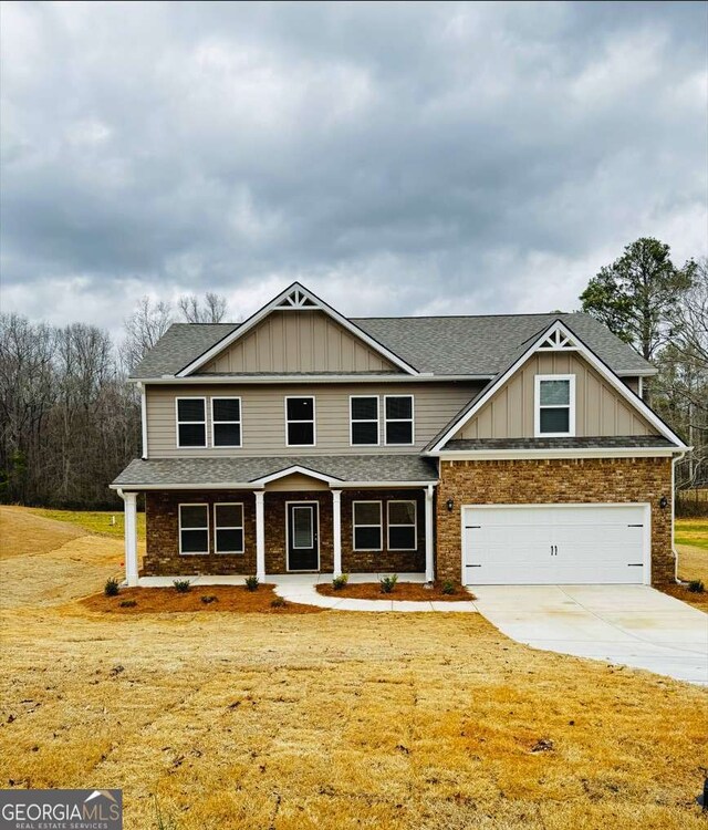61 Observation Way, Dallas, GA 30132 - craftsman inspired home with a shingled roof, board and batten siding, driveway, and a garage