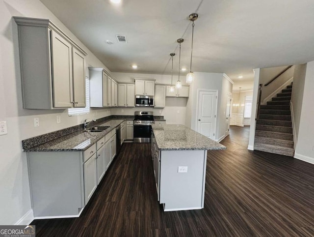 61 Observation Way, Dallas, GA 30132 - kitchen with appliances with stainless steel finishes, baseboards, dark wood-type flooring, dark stone counters, and recessed lighting
