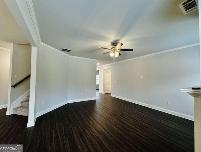 61 Observation Way, Dallas, GA 30132 - unfurnished living room featuring ceiling fan, baseboards, dark wood-type flooring, stairs, and ornamental molding