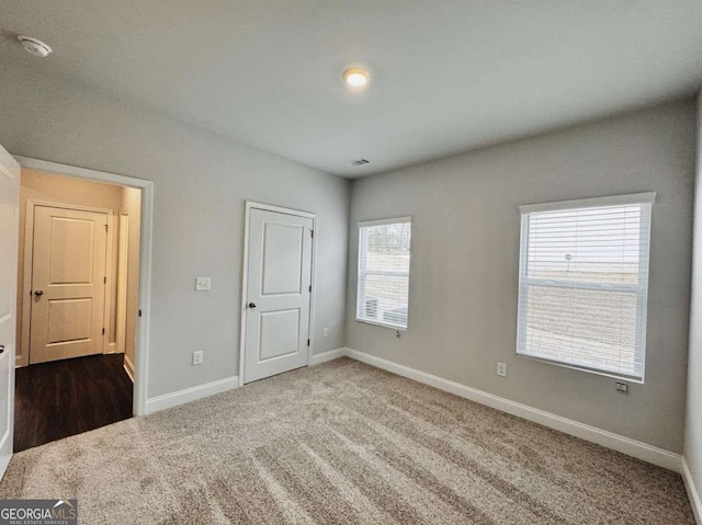 61 Observation Way, Dallas, GA 30132 - unfurnished bedroom featuring dark colored carpet and baseboards
