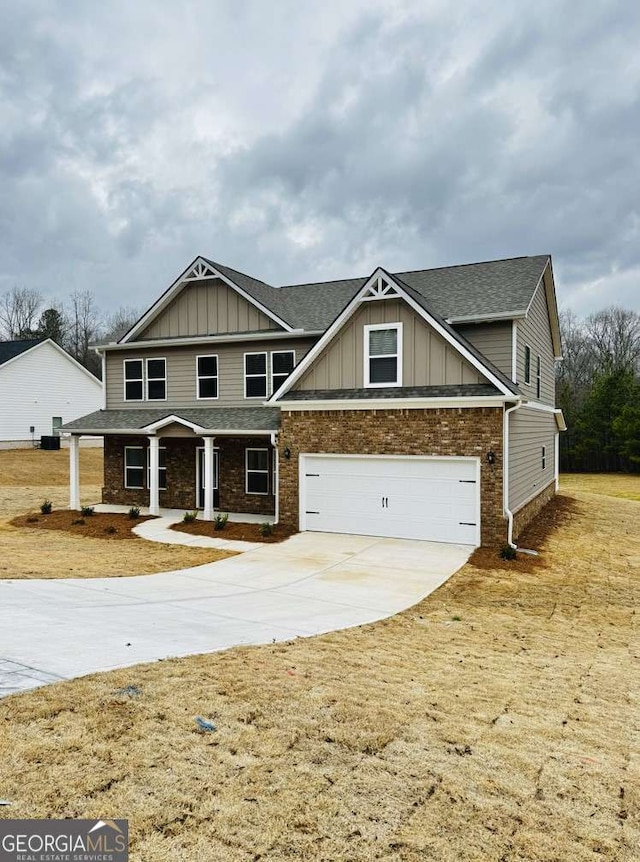 61 Observation Way, Dallas, GA 30132 - craftsman-style home with board and batten siding, a garage, driveway, and a shingled roof