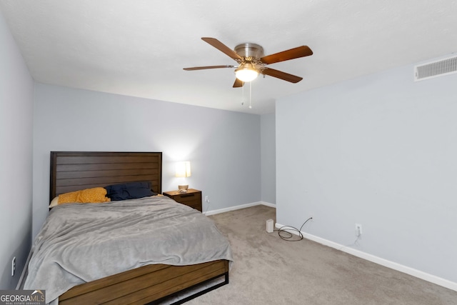 bedroom featuring baseboards, a ceiling fan, carpet flooring, and visible vents