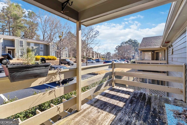wooden deck featuring a residential view