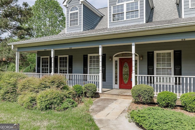 36 Blackthorn Ln, Colbert, GA 30628 - view of exterior entry featuring a porch and roof with shingles