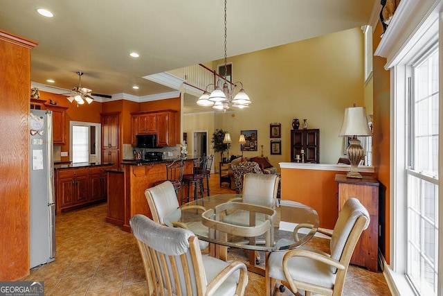 36 Blackthorn Ln, Colbert, GA 30628 - dining room with light tile patterned floors, a ceiling fan, recessed lighting, ornamental molding, and a chandelier