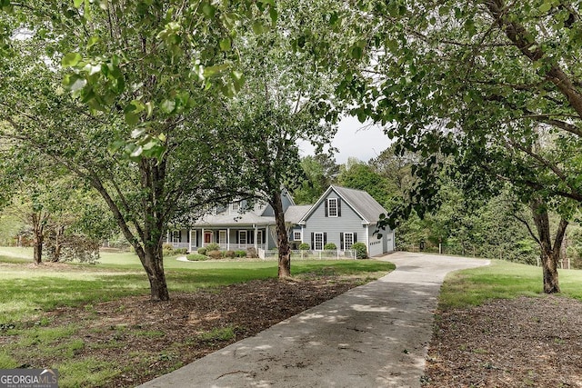 36 Blackthorn Ln, Colbert, GA 30628 - view of front of property featuring a front yard, driveway, covered porch, and a garage