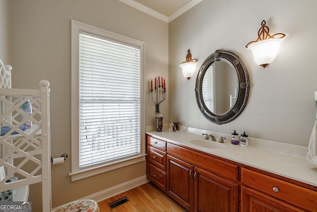 36 Blackthorn Ln, Colbert, GA 30628 - bathroom featuring crown molding, vanity, wood finished floors, and baseboards