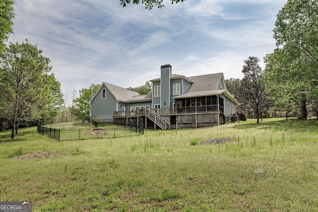 36 Blackthorn Ln, Colbert, GA 30628 - rear view of house with a sunroom, a chimney, a wooden deck, and stairway