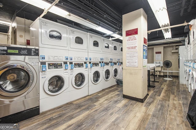 300 W Peachtree St Unit 21K, Atlanta, GA 30305 - shared laundry with stacked washer and clothes dryer, washer and clothes dryer, and wood finished floors