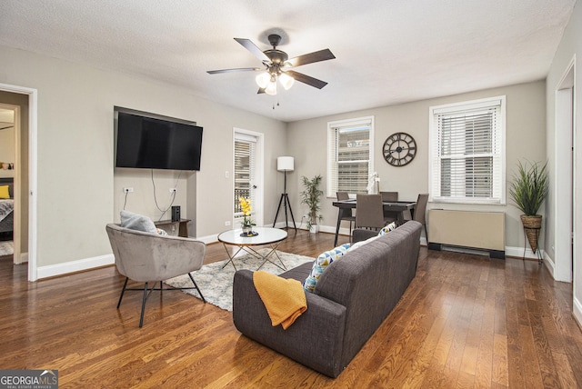 300 W Peachtree St Unit 21K, Atlanta, GA 30305 - living room with a ceiling fan, wood finished floors, and radiator heating unit