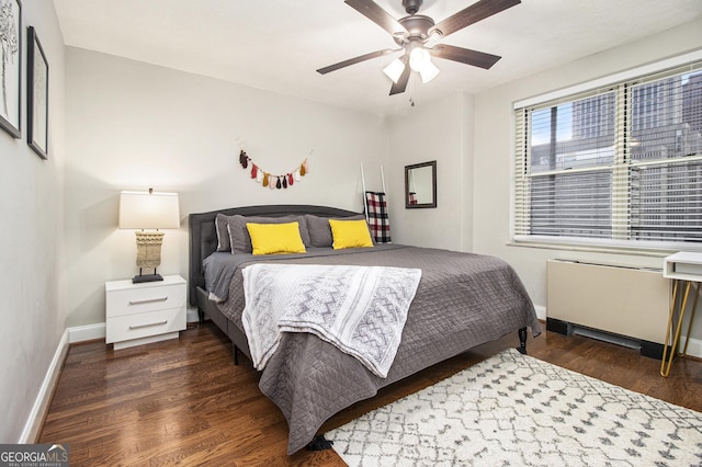300 W Peachtree St Unit 21K, Atlanta, GA 30305 - bedroom featuring wood finished floors, a ceiling fan, and radiator