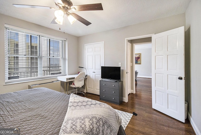 300 W Peachtree St Unit 21K, Atlanta, GA 30305 - bedroom with dark wood finished floors, a closet, ceiling fan, and a textured ceiling