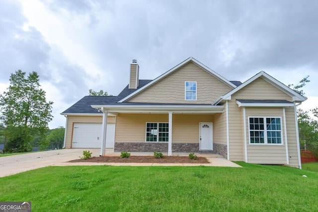 view of front of home featuring stone siding, driveway, a front yard, a garage, and a chimney