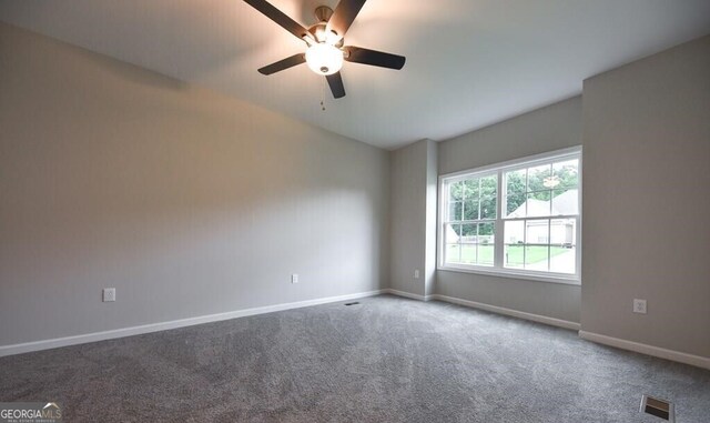 carpeted empty room featuring a ceiling fan, baseboards, and visible vents