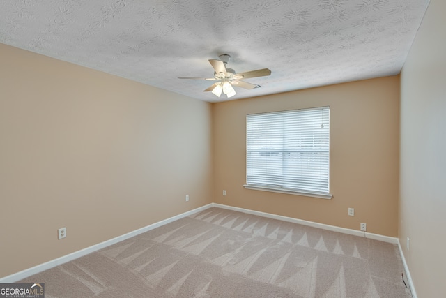 3024 Big Tree Rd, Gainesville, GA 30501 - empty room featuring light carpet, a ceiling fan, baseboards, and a textured ceiling
