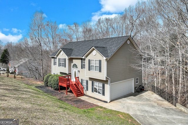 3024 Big Tree Rd, Gainesville, GA 30501 - bi-level home with an attached garage, concrete driveway, a front lawn, stairway, and roof with shingles