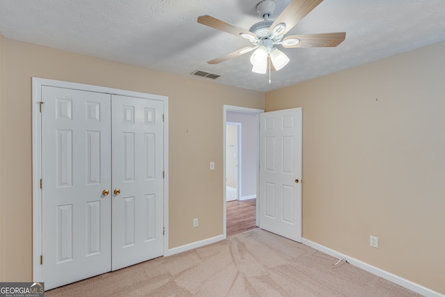 3024 Big Tree Rd, Gainesville, GA 30501 - unfurnished bedroom featuring baseboards, light colored carpet, a closet, and a ceiling fan