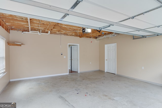 3024 Big Tree Rd, Gainesville, GA 30501 - garage featuring a garage door opener and baseboards