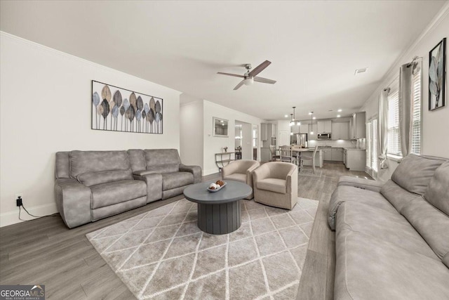 372 Garnet Dr, Acworth, GA 30101 - living room with a ceiling fan, light wood-style flooring, and baseboards