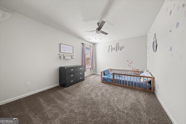 372 Garnet Dr, Acworth, GA 30101 - carpeted bedroom with baseboards and ceiling fan