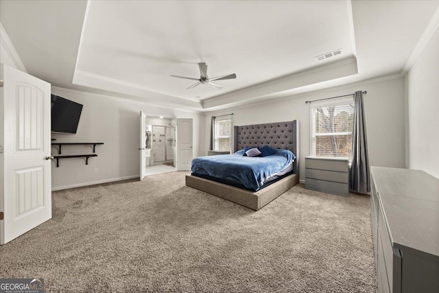 372 Garnet Dr, Acworth, GA 30101 - carpeted bedroom featuring a raised ceiling, multiple windows, crown molding, connected bathroom, and a ceiling fan