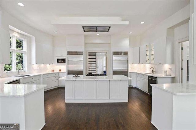 510 Covington Cv, Alpharetta, GA 30022 - kitchen with appliances with stainless steel finishes, a sink, white cabinetry, dark wood-type flooring, and recessed lighting