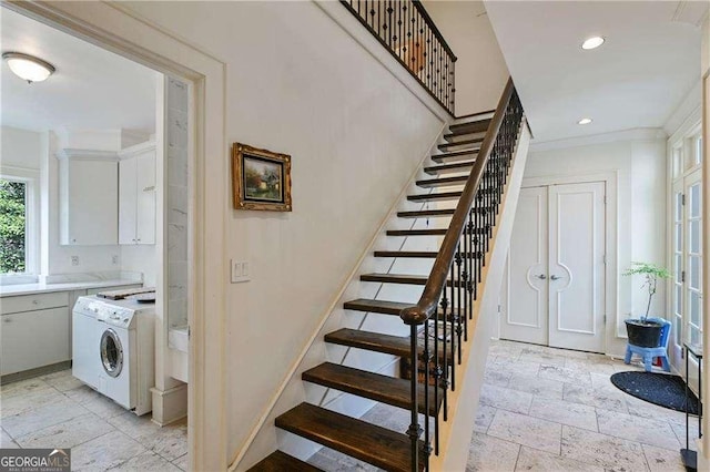 staircase featuring recessed lighting, stone tile floors, washer / clothes dryer, and french doors