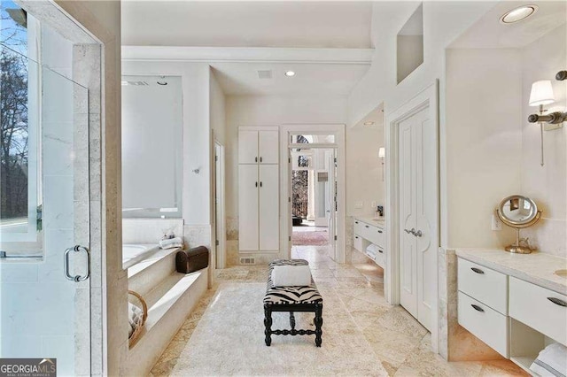bathroom with vanity, tile patterned floors, a bath, and a shower stall