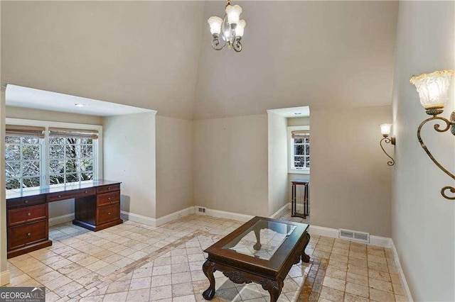 510 Covington Cv, Alpharetta, GA 30022 - living room with high vaulted ceiling, a chandelier, baseboards, and inlaid floor details