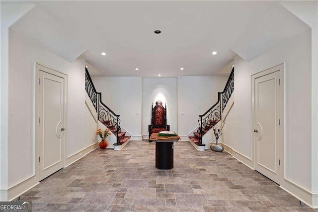 entrance foyer with recessed lighting, stairs, and baseboards