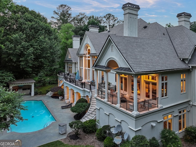 510 Covington Cv, Alpharetta, GA 30022 - rear view of property with a chimney, a patio area, a standing seam roof, and stairs