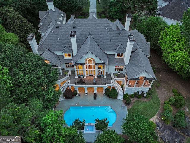 510 Covington Cv, Alpharetta, GA 30022 - back of house featuring a chimney, stairs, a balcony, and a patio