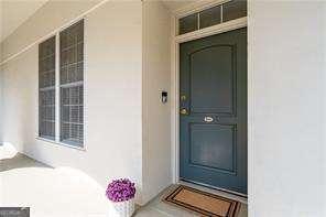 doorway to property with stucco siding