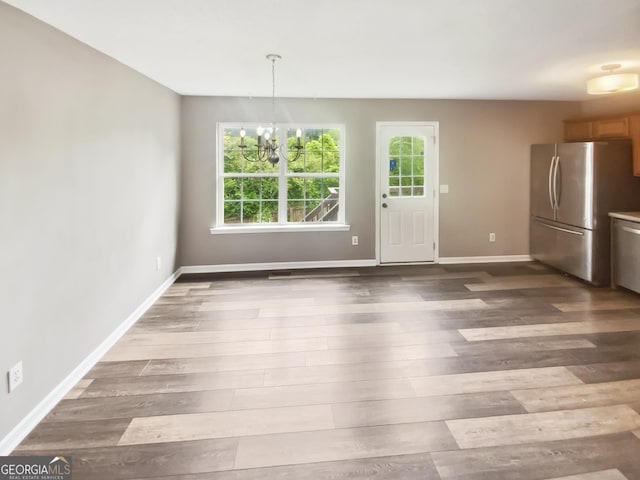 10 Jasmine Ln SW, Euharlee, GA 30120 - unfurnished dining area featuring a chandelier, baseboards, and wood finished floors