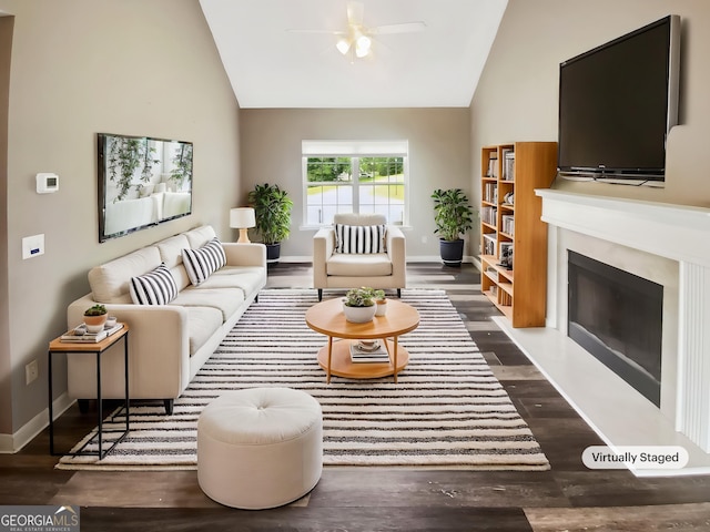 10 Jasmine Ln SW, Euharlee, GA 30120 - living room featuring ceiling fan, a glass covered fireplace, baseboards, high vaulted ceiling, and wood finished floors