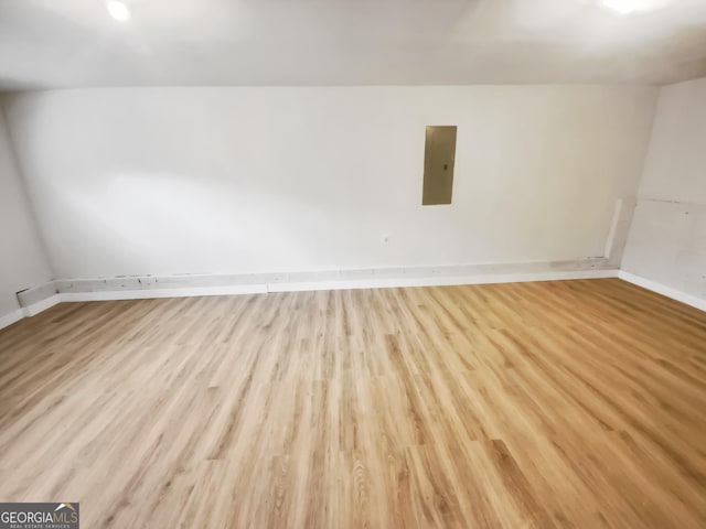 10 Jasmine Ln SW, Euharlee, GA 30120 - unfurnished room featuring electric panel, light wood finished floors, and baseboards