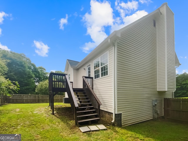 10 Jasmine Ln SW, Euharlee, GA 30120 - view of property exterior with stairway, a wooden deck, and a chimney