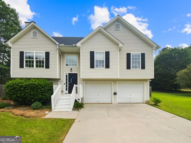 10 Jasmine Ln SW, Euharlee, GA 30120 - split foyer home with an attached garage, a front yard, and driveway