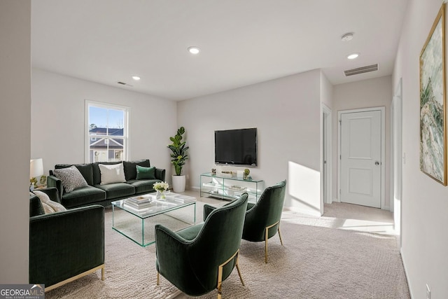 living area with recessed lighting, carpet flooring, and visible vents