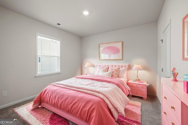carpeted bedroom with baseboards and visible vents